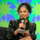 Angela Yee of iHeart Media introduces Lizzo, not pictured, for a keynote speech at the Austin Convention Center during the South by Southwest Music Festival on Sunday, March 13, 2022, in Austin, Texas.